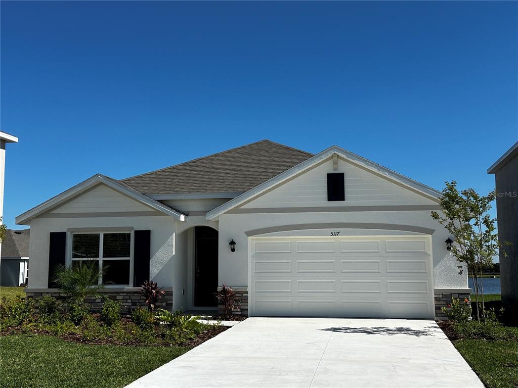 a front view of a house with a garage