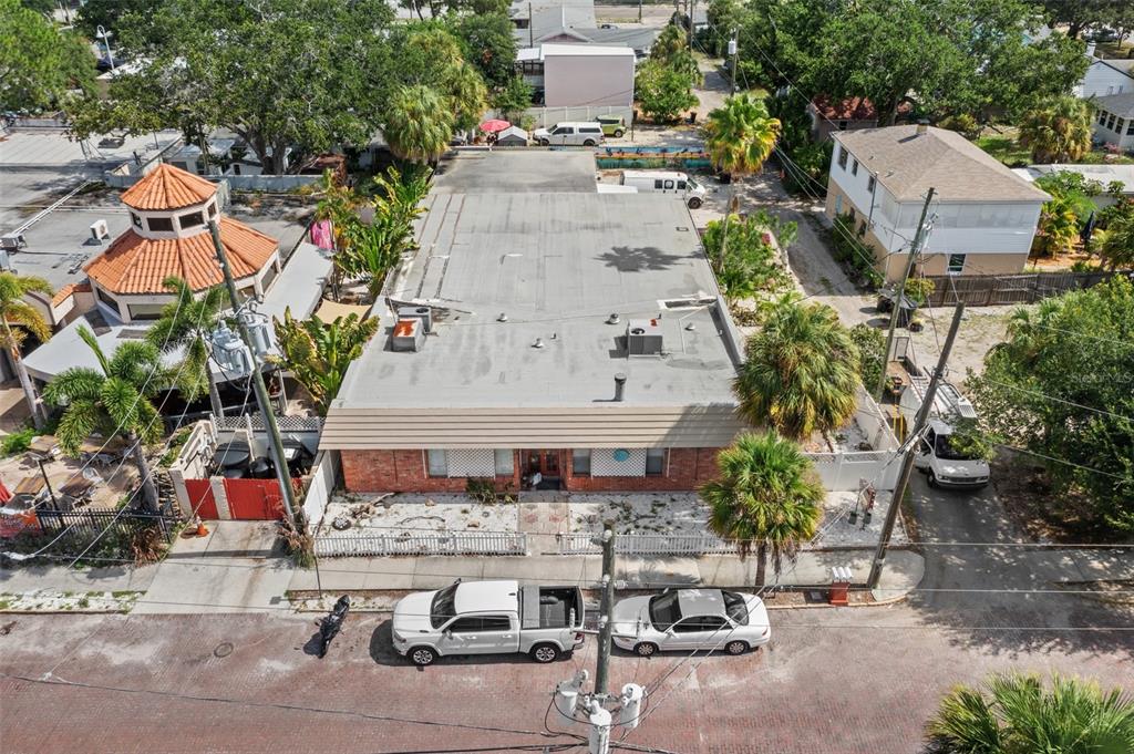 an aerial view of a house with outdoor space