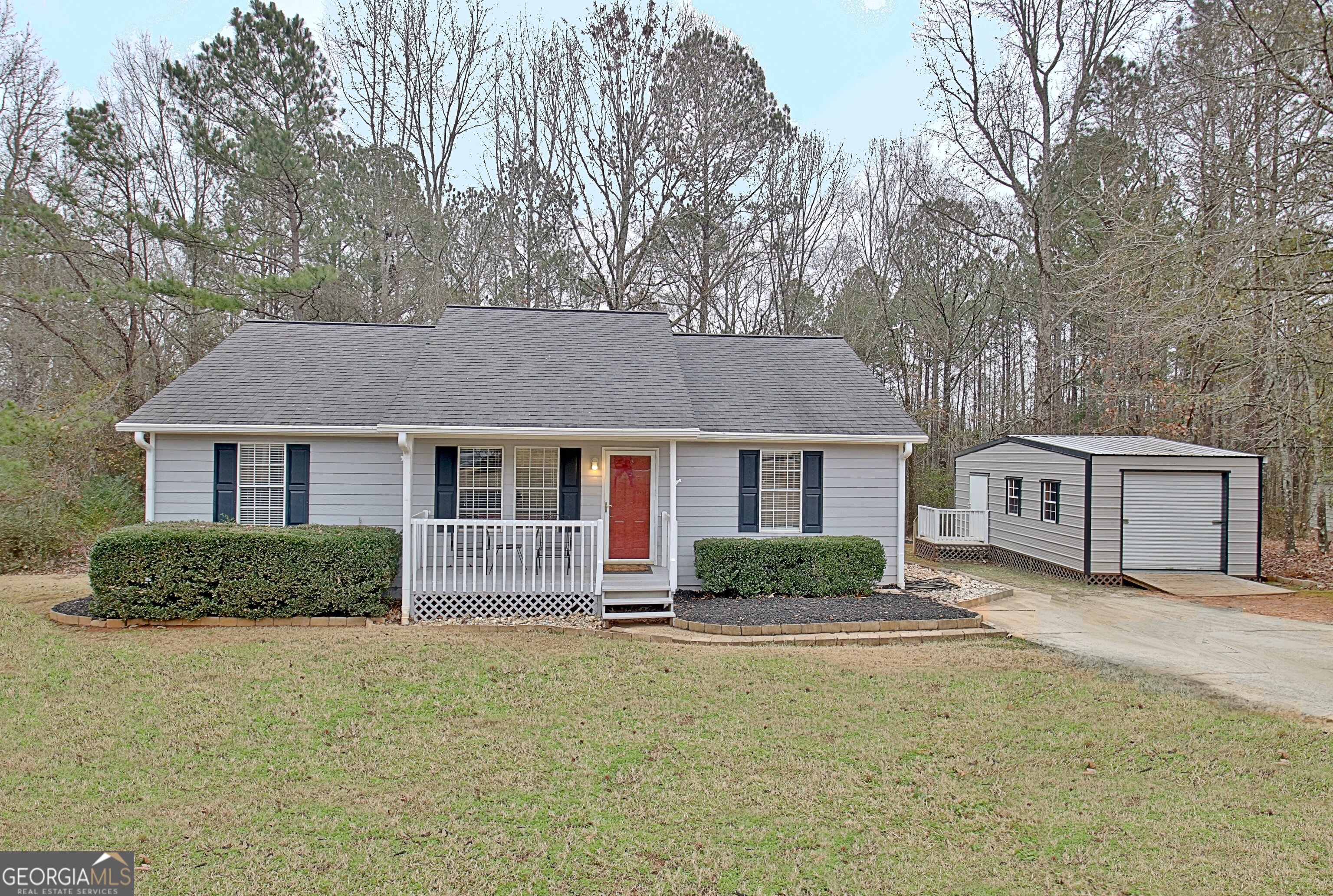 front view of a house next to a yard