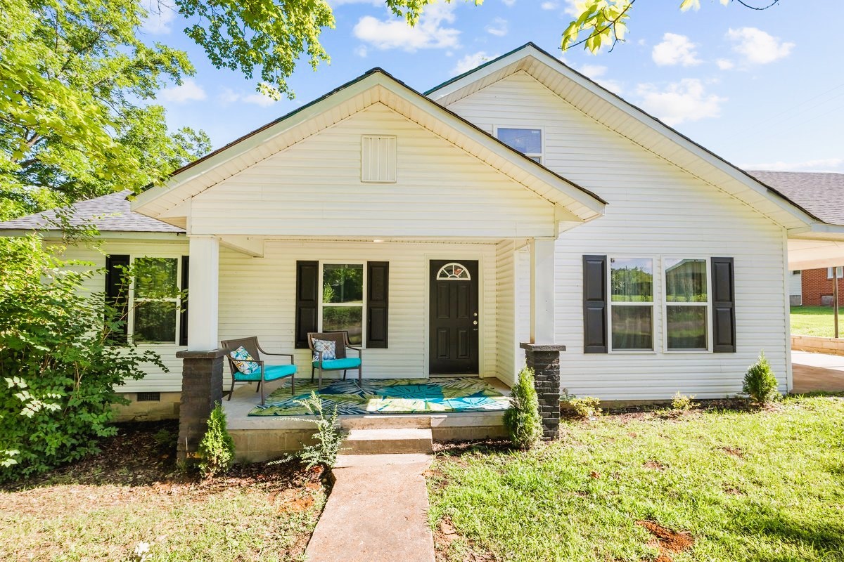 a front view of house with outdoor seating