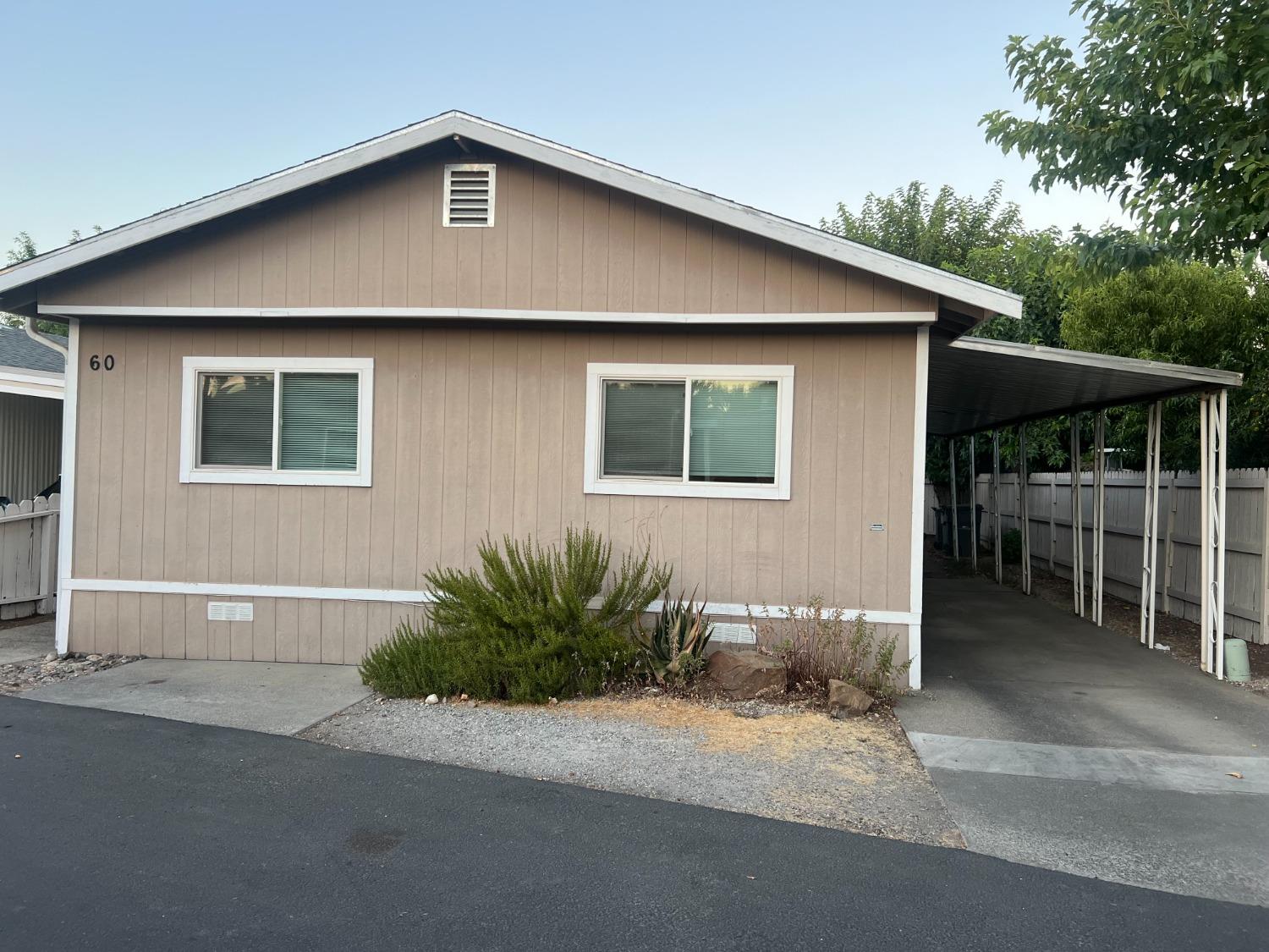 a front view of a house with yard