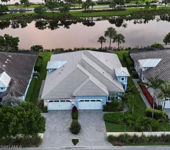 an aerial view of a house with a lake view