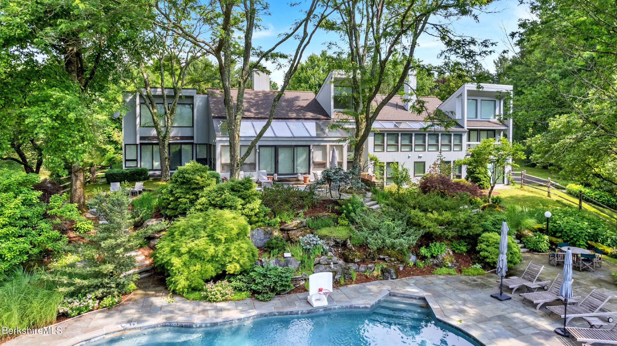 a front view of a house with a garden