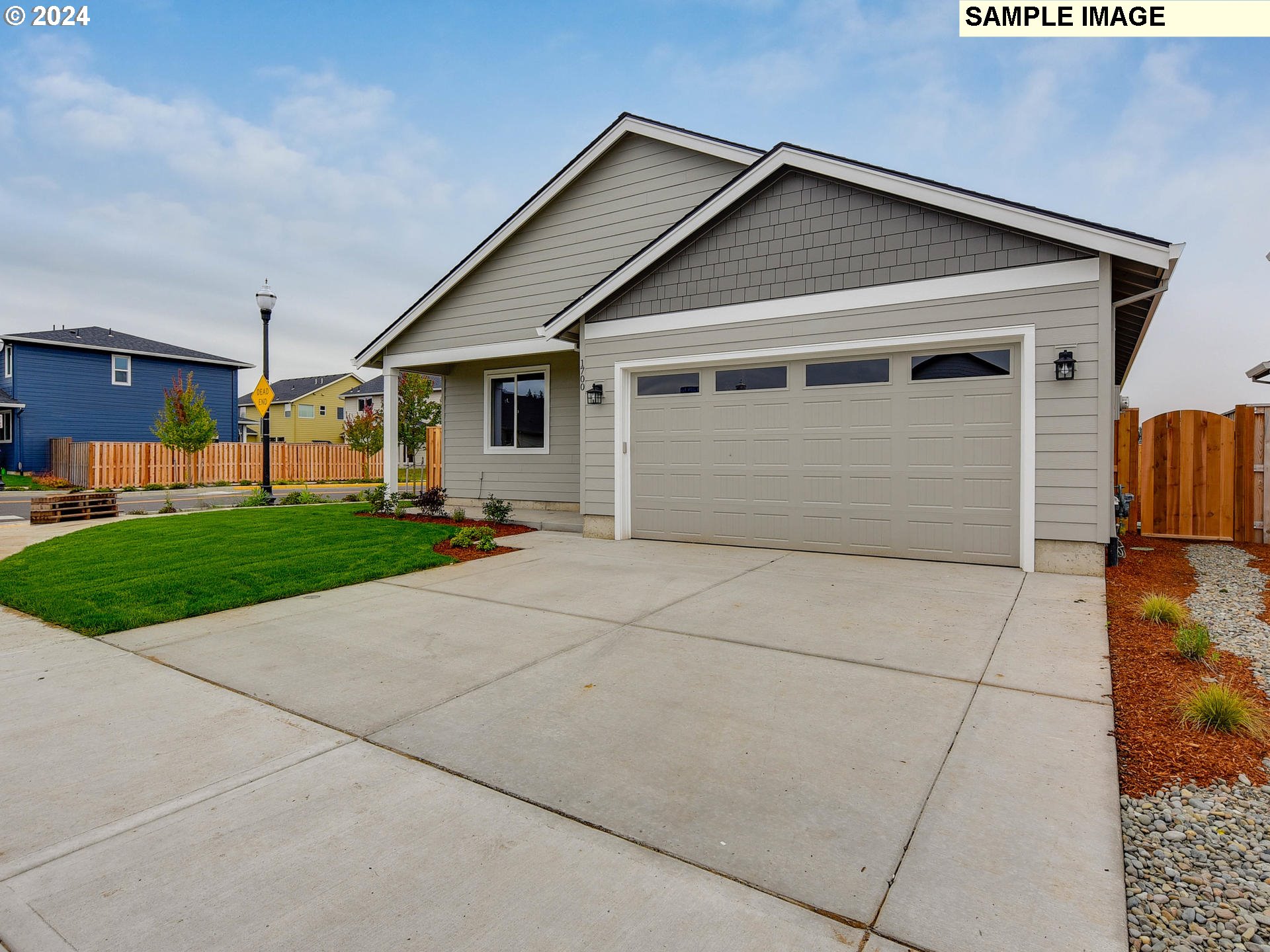 a view of a house with a yard and garage