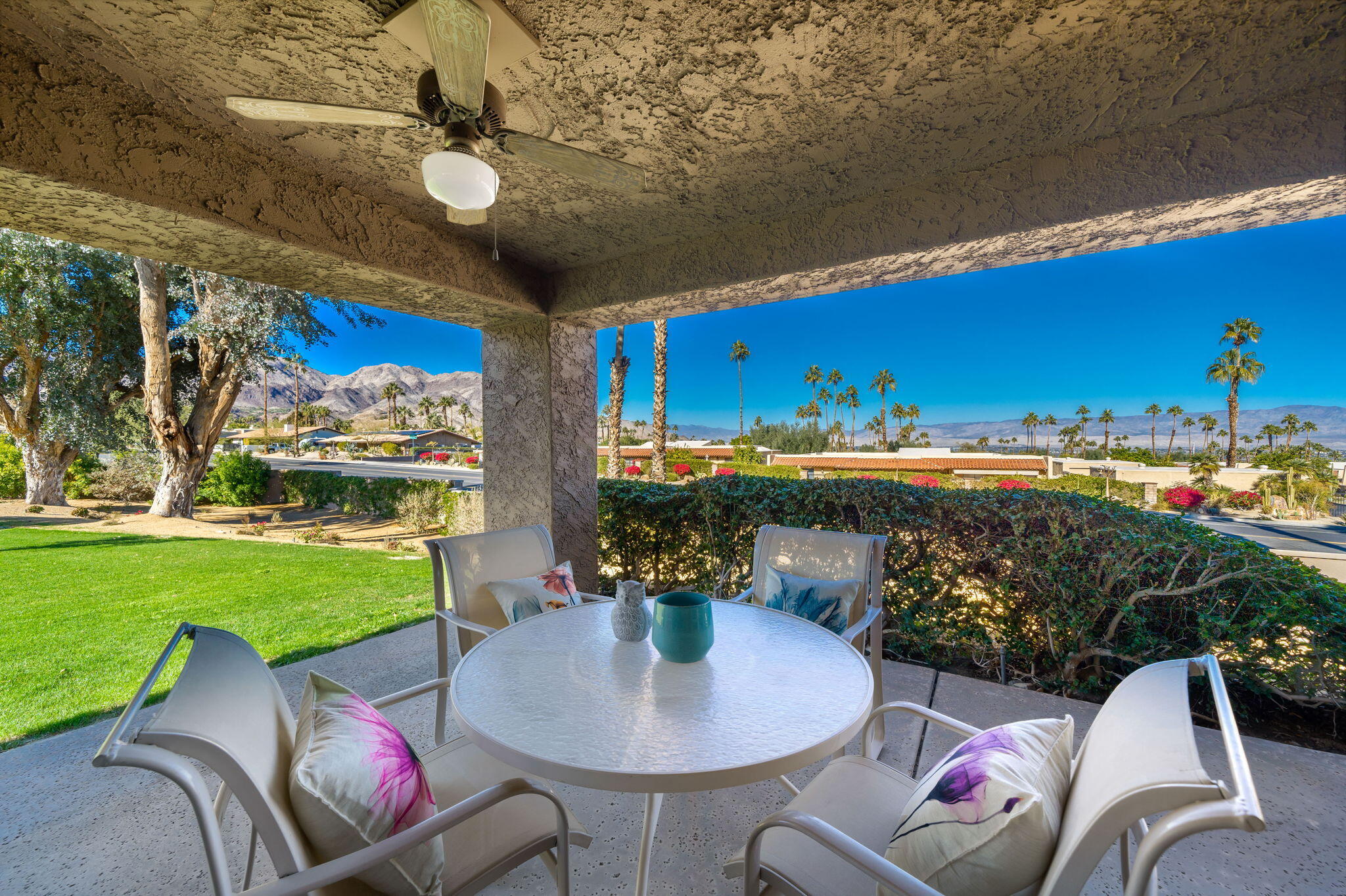 a outdoor dining space with furniture and garden view