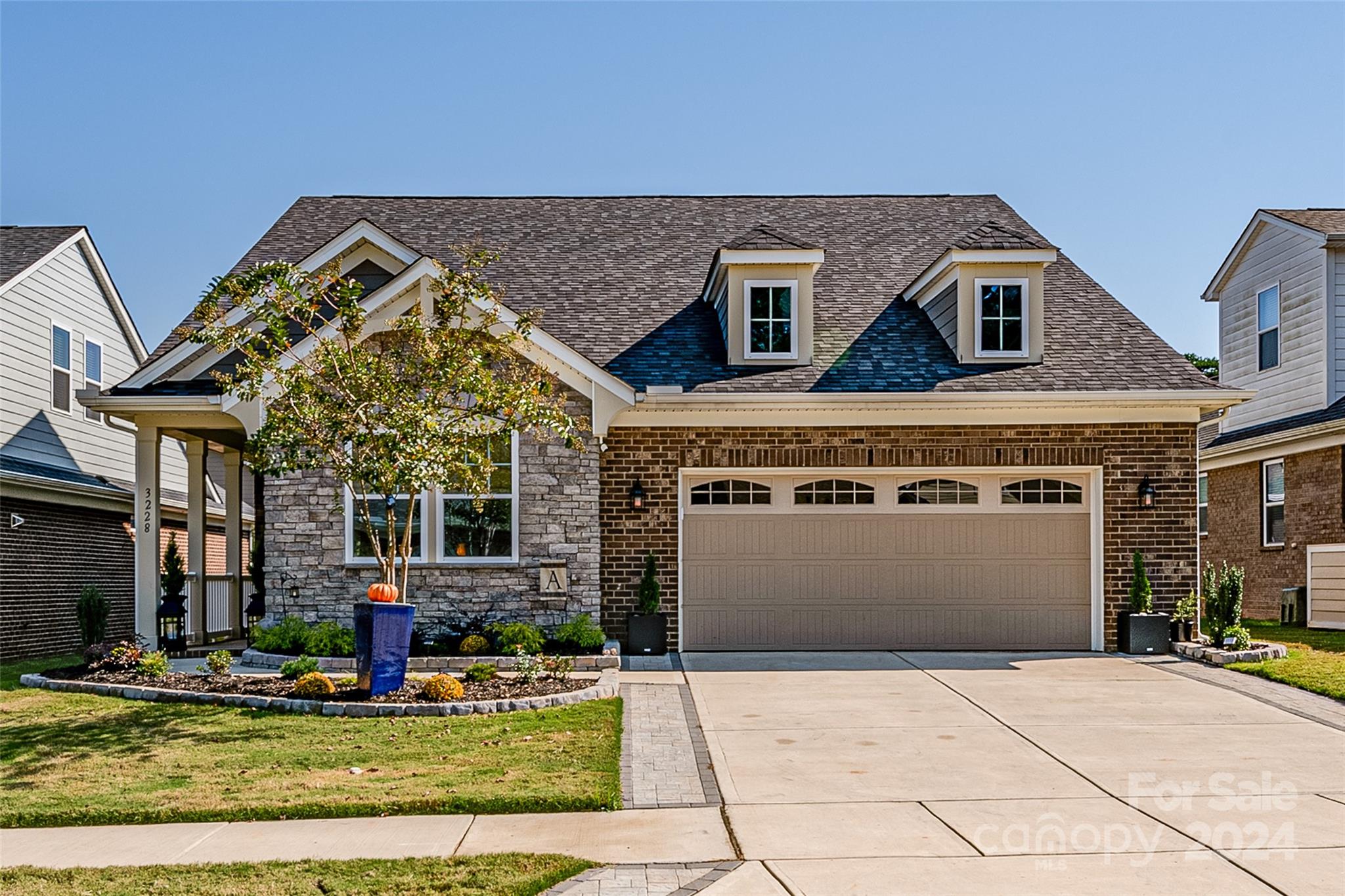 a front view of a house with garden