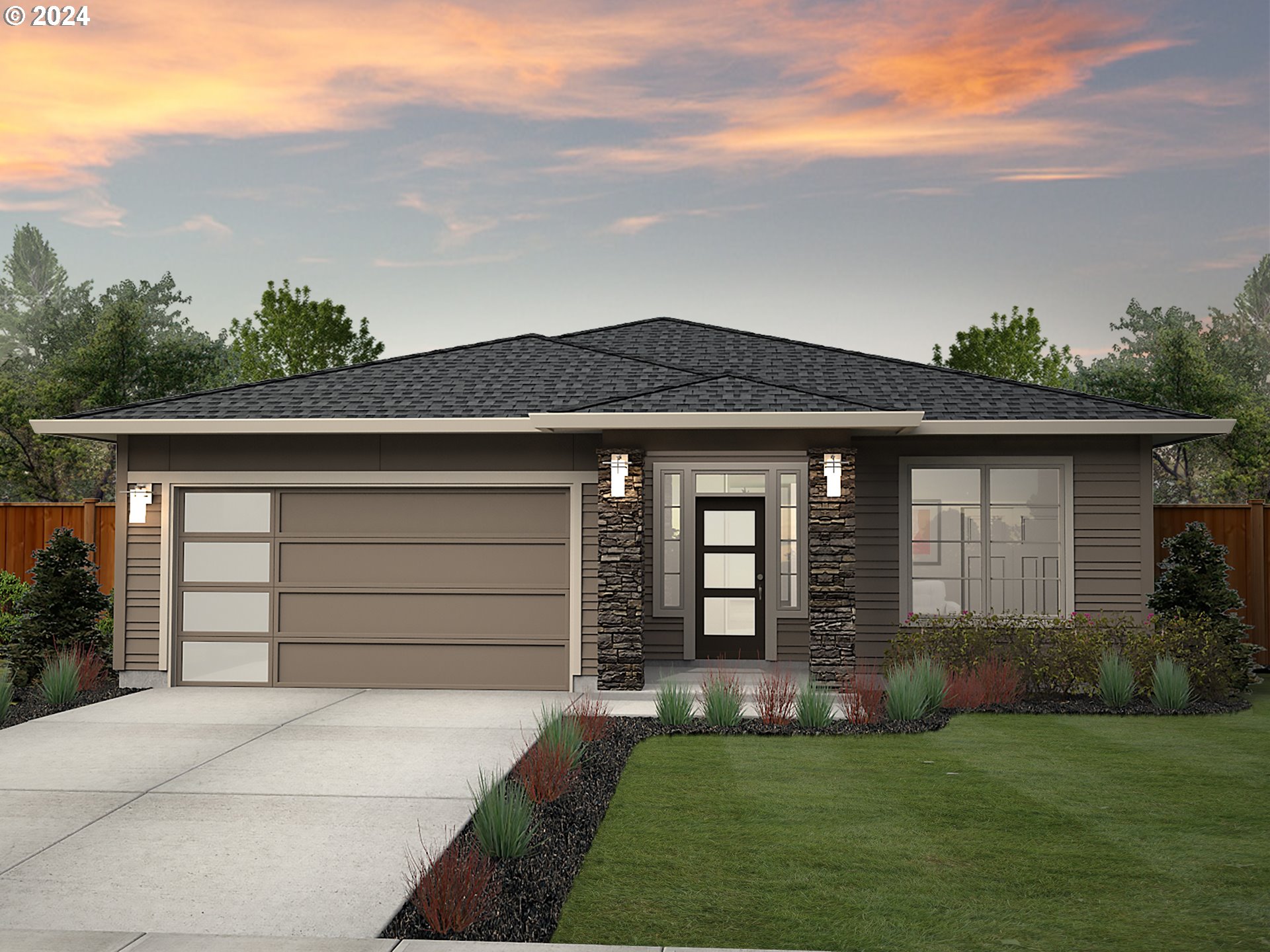 a front view of a house with a garden and garage