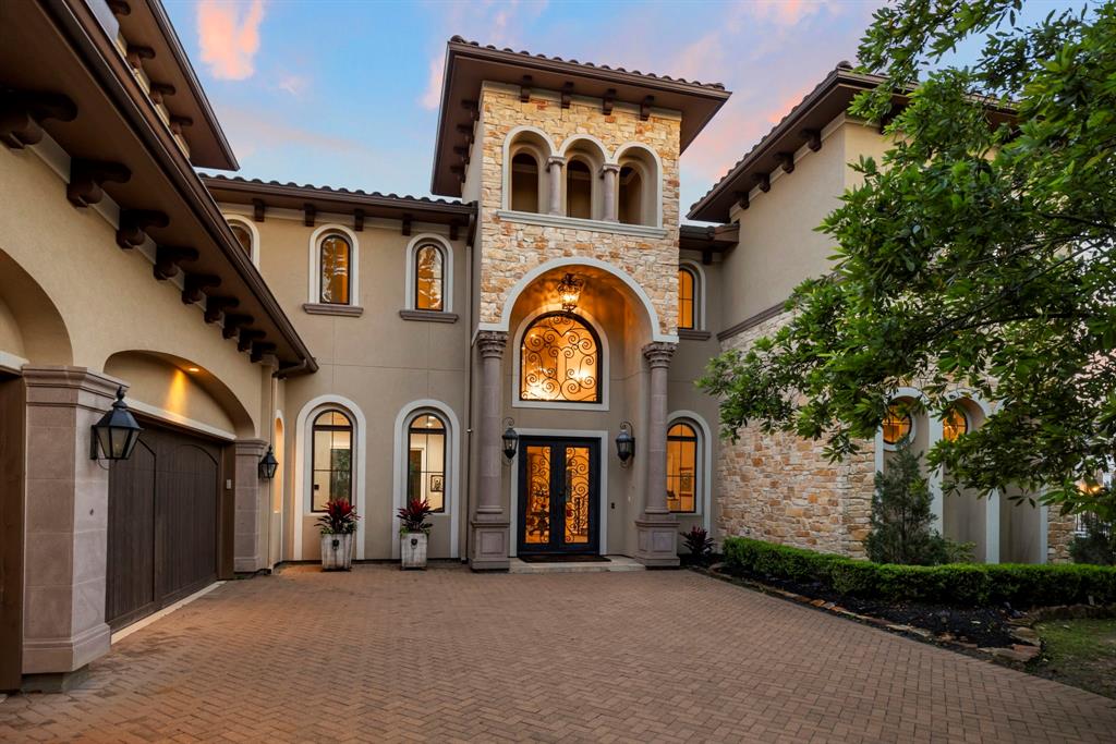 Welcome to 6 Berkley Hall Ct - where timeless elegance meets contemporary sophistication.  This custom-built Elite home offers Mediterranean style multiple colored tile roof and stucco exterior with stone accent and modern touches throughout.