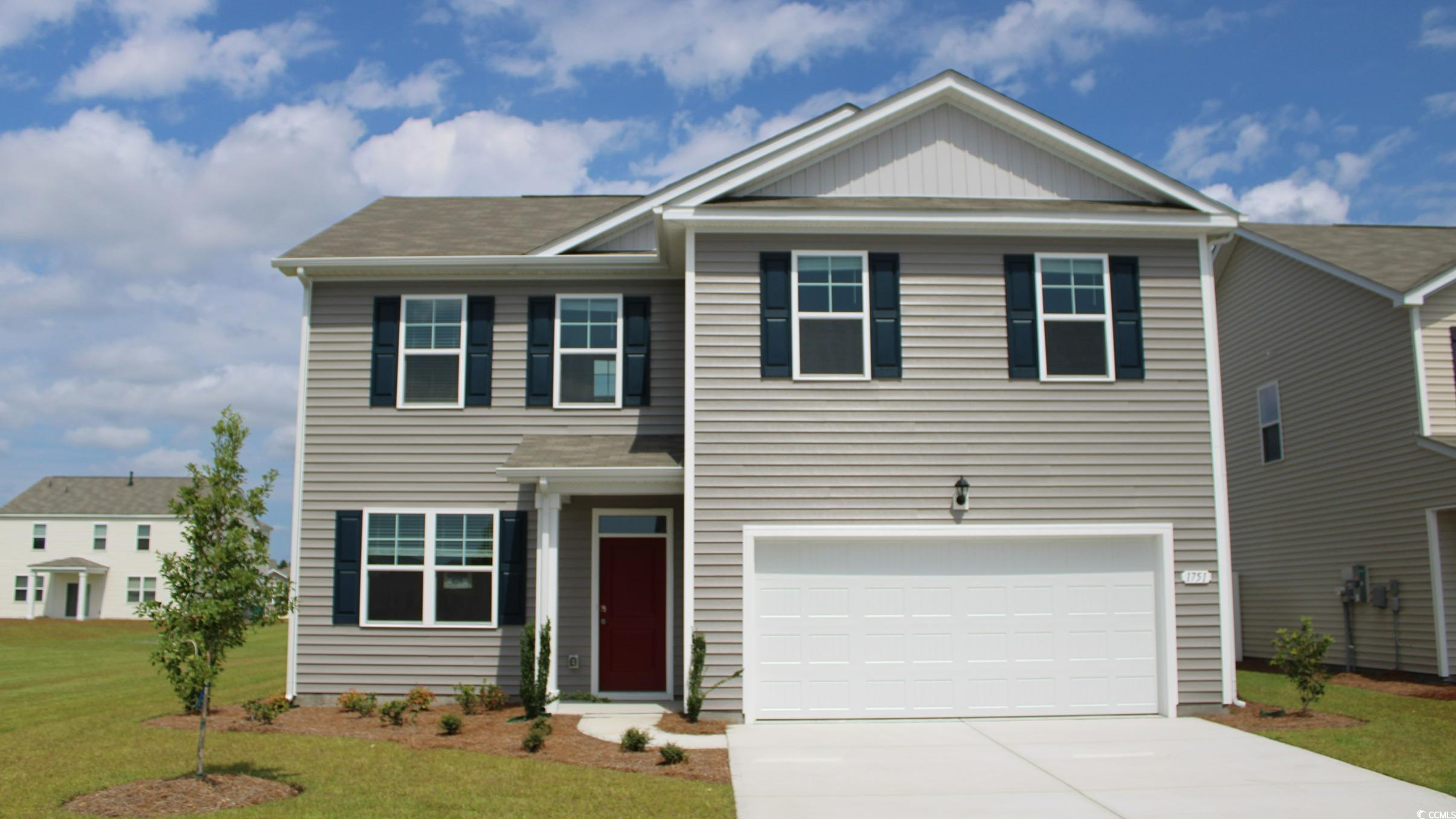 View of front of property featuring a front yard a