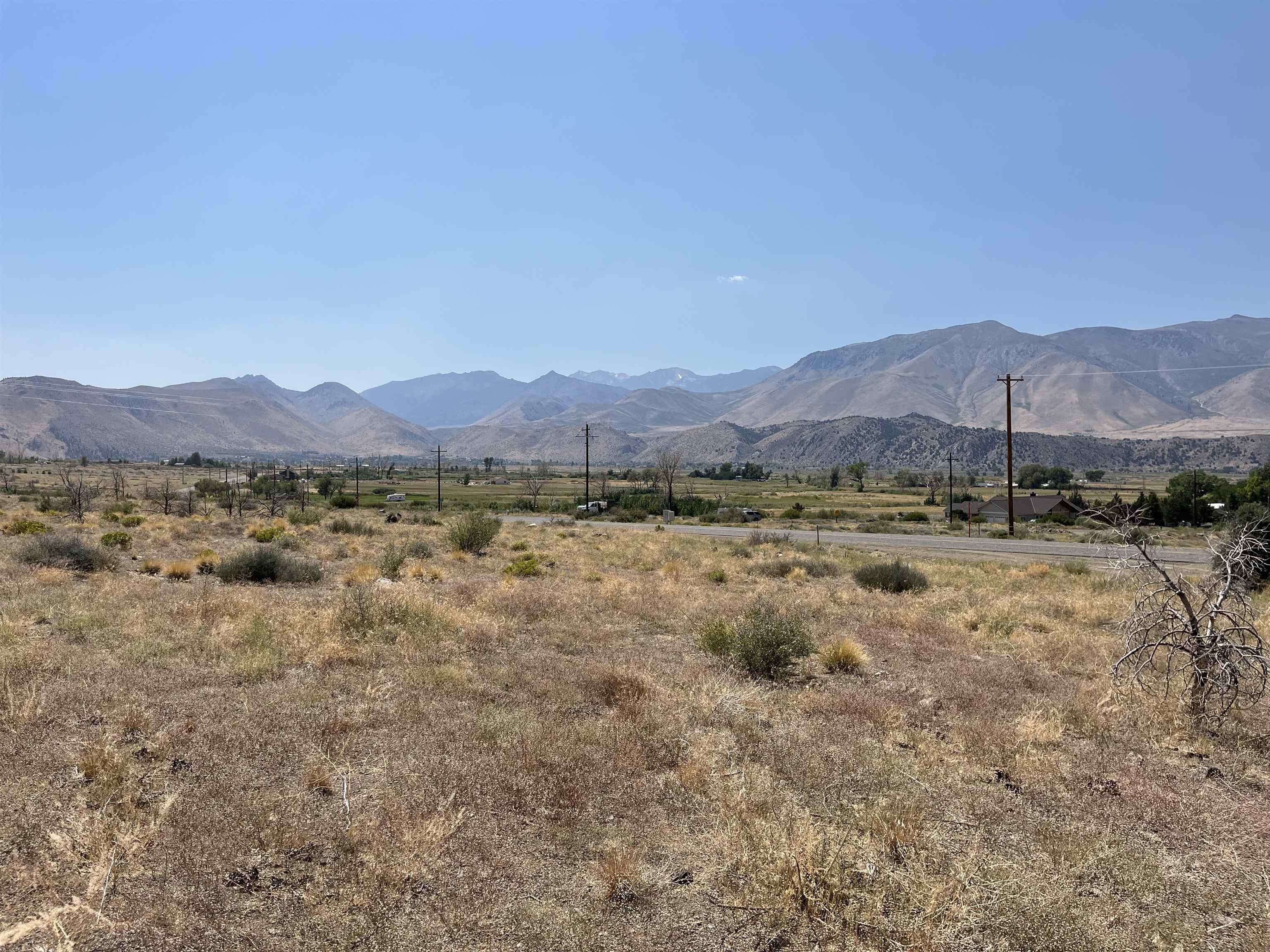 a view of a town with mountains in the background