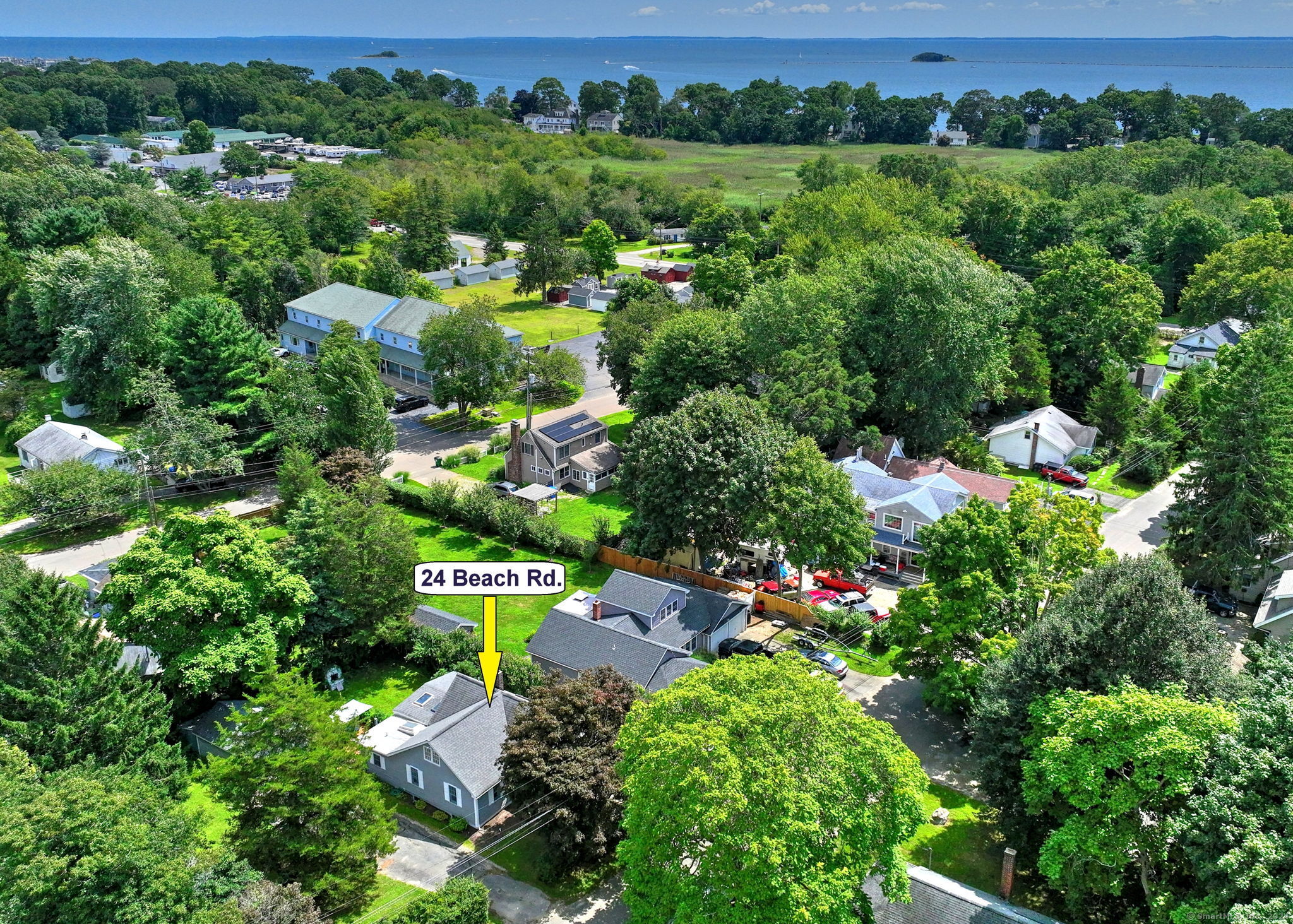 an aerial view of a house with yard