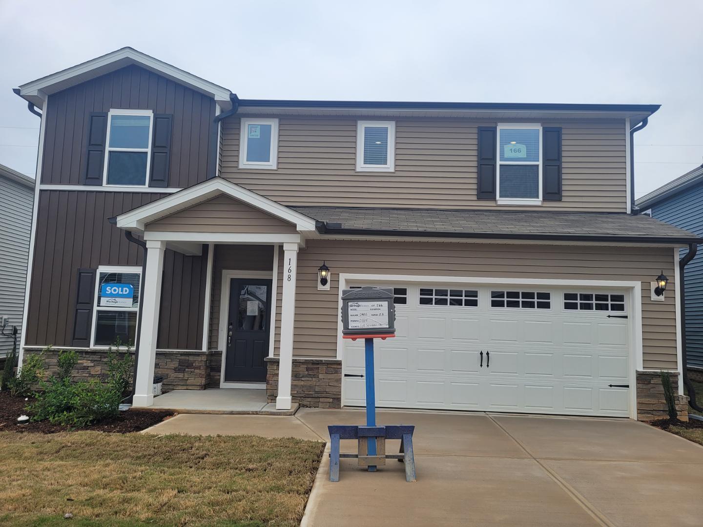 a front view of a house with a garage