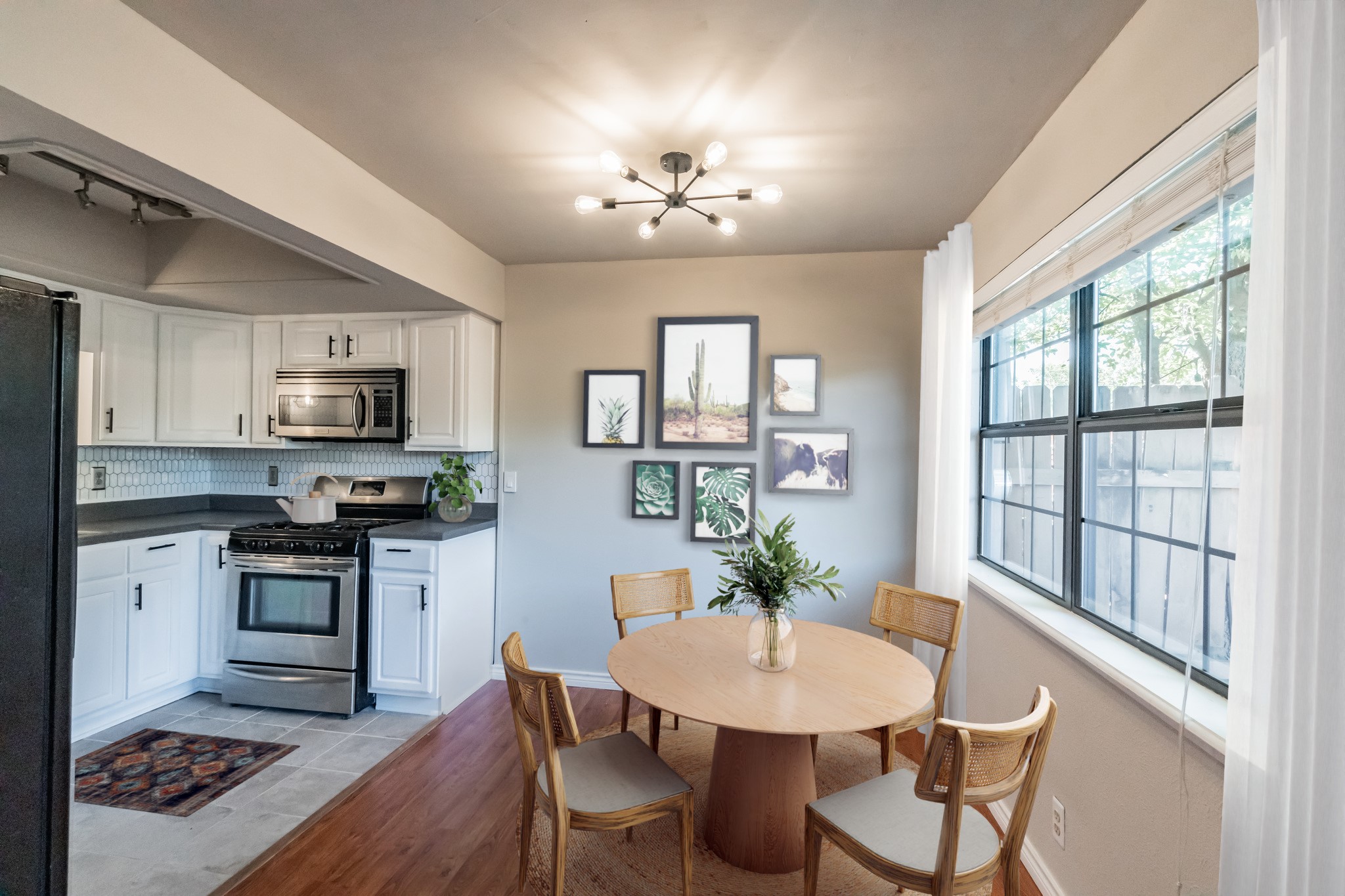 a view of a dining room with furniture window and wooden floor