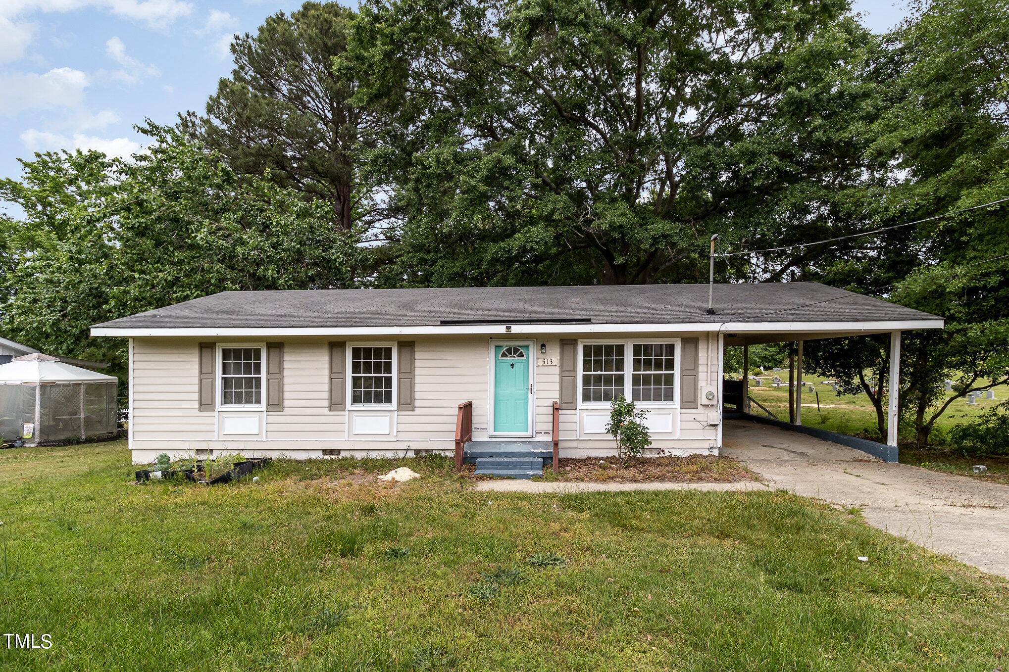 a front view of house with yard and green space