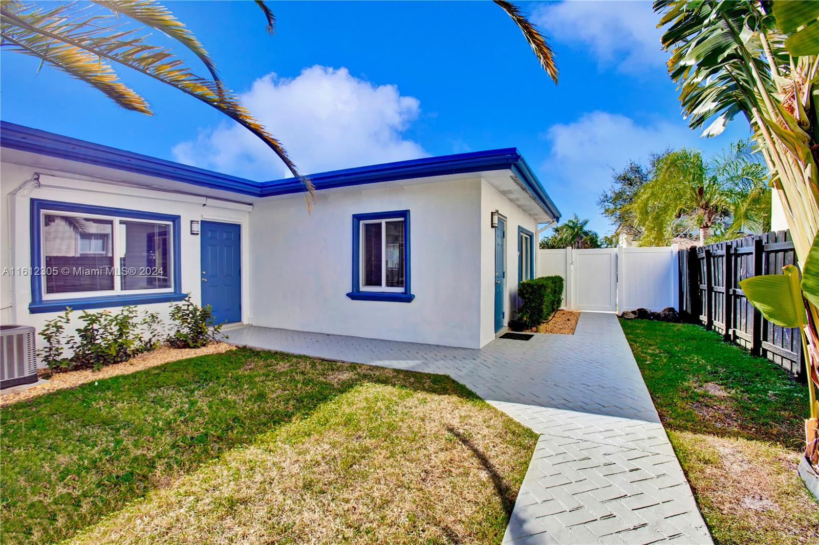 a house with garden in front of it