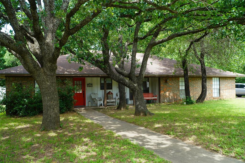 a view of a trees in front of a house