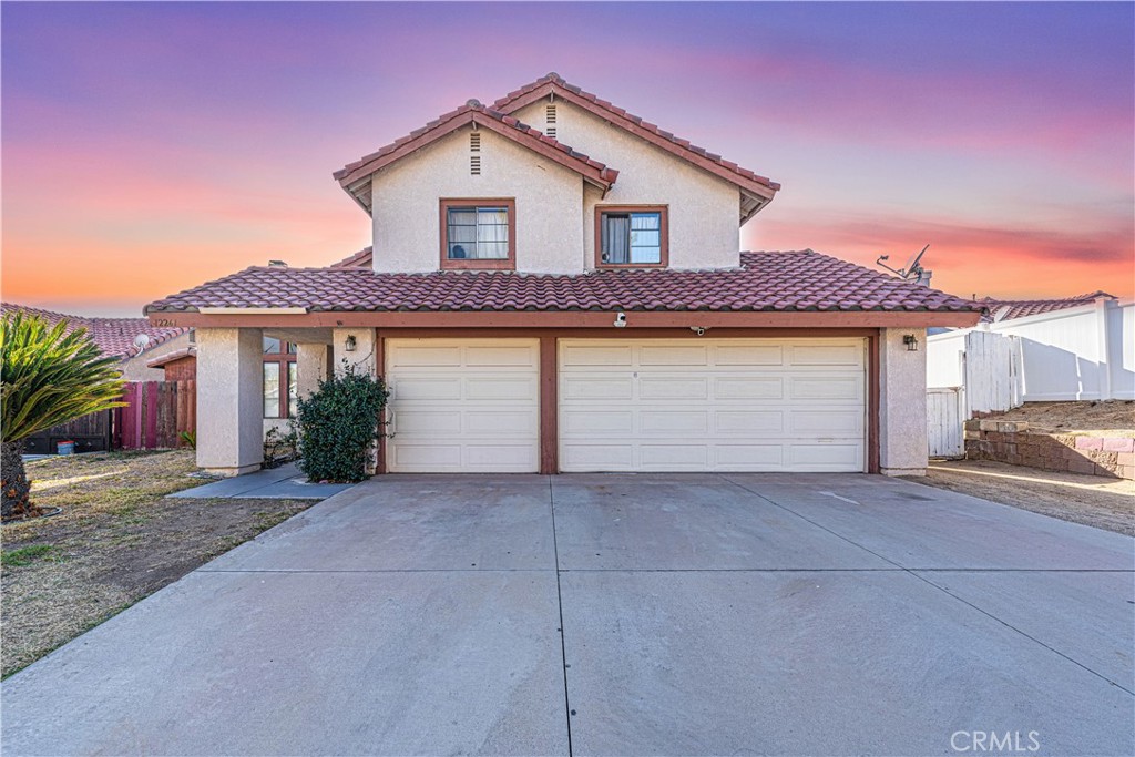 a front view of a house with a garage and a garage