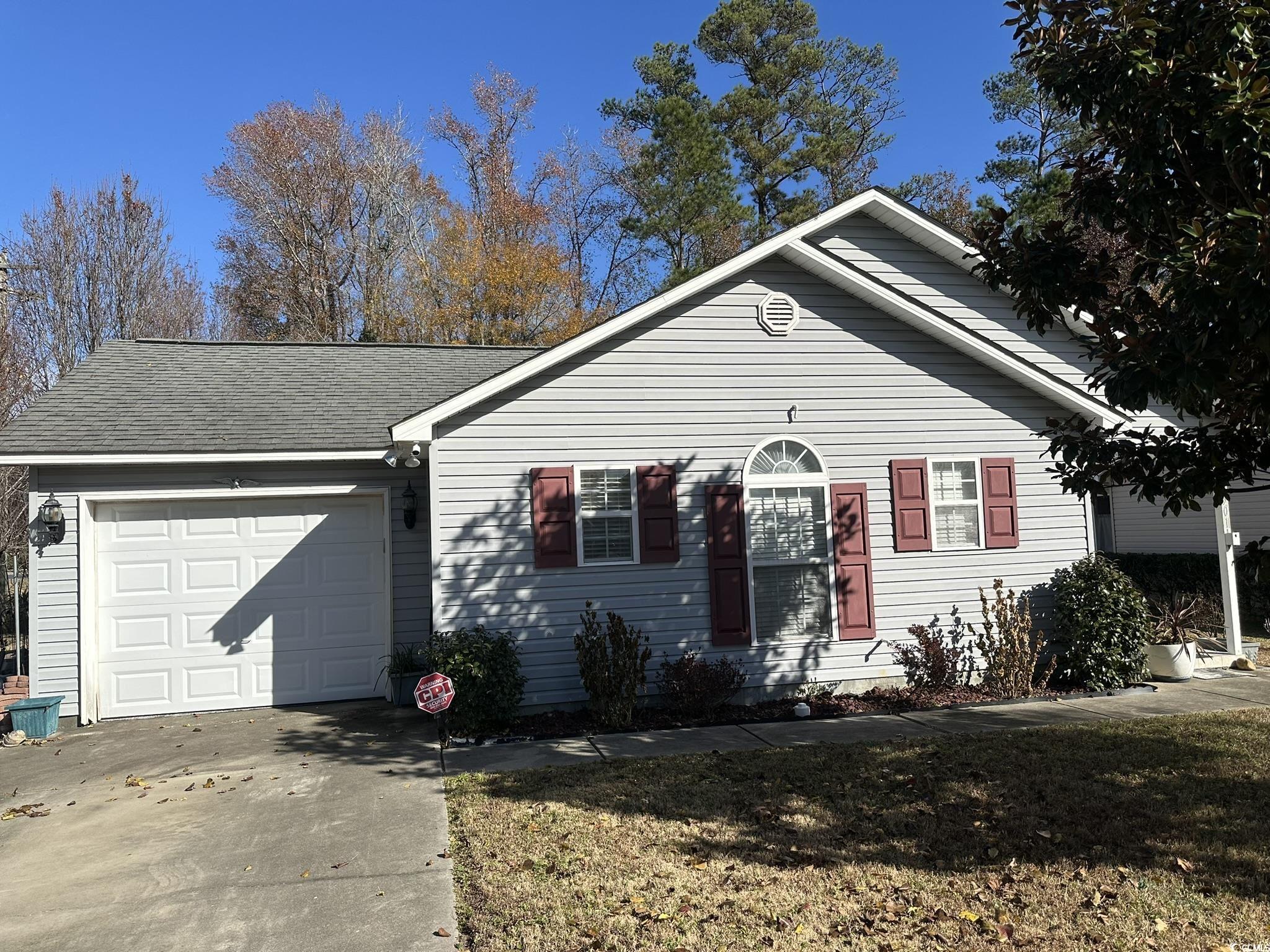 Single story home featuring a garage