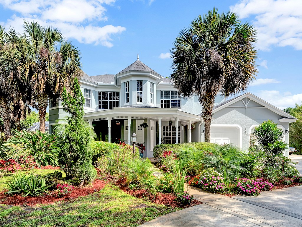 front view of a house with a garden