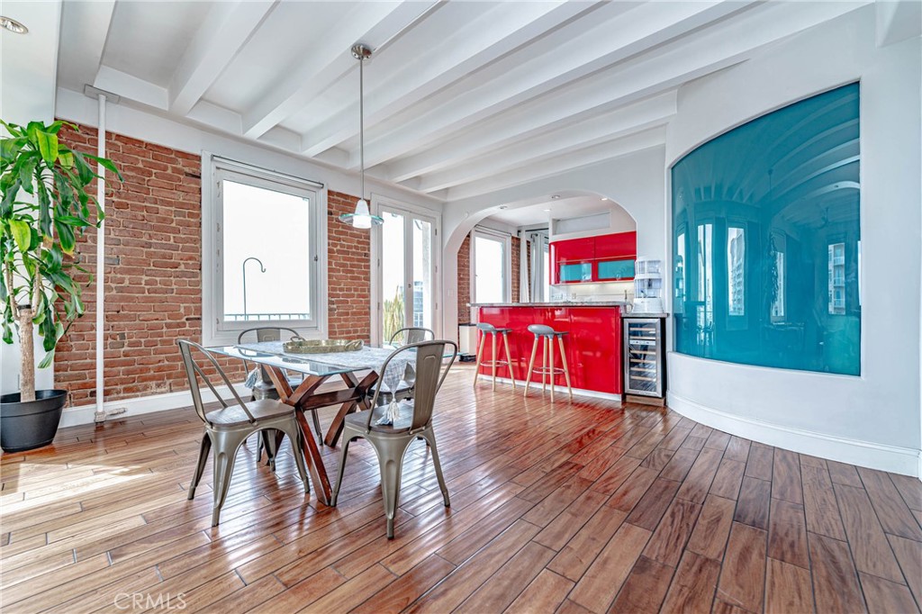 a view of a dining room with furniture window and wooden floor