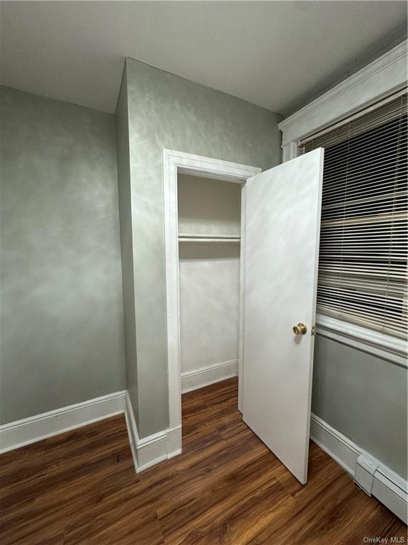 Closet featuring baseboard heating