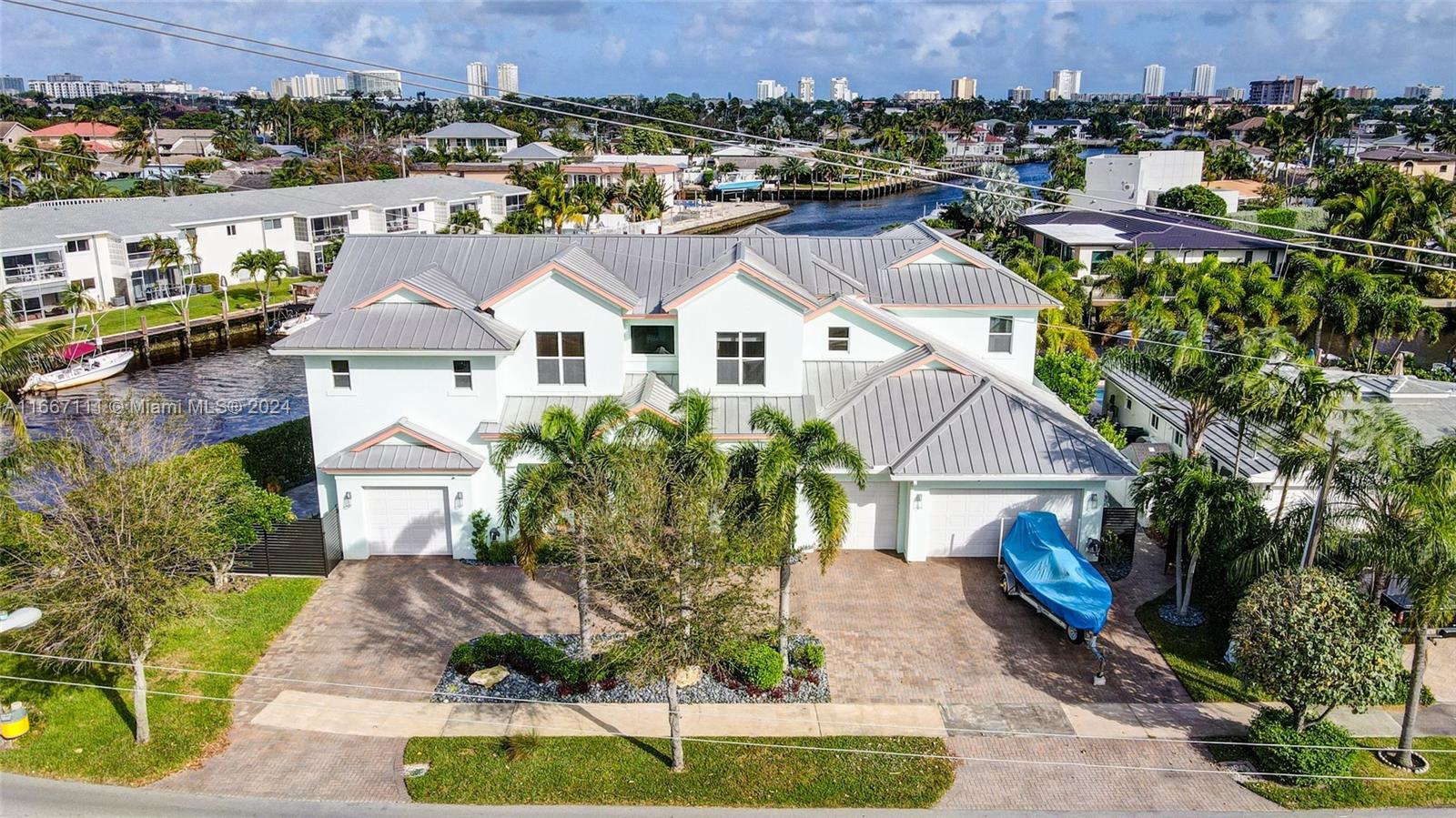 a aerial view of a house with a yard and plants