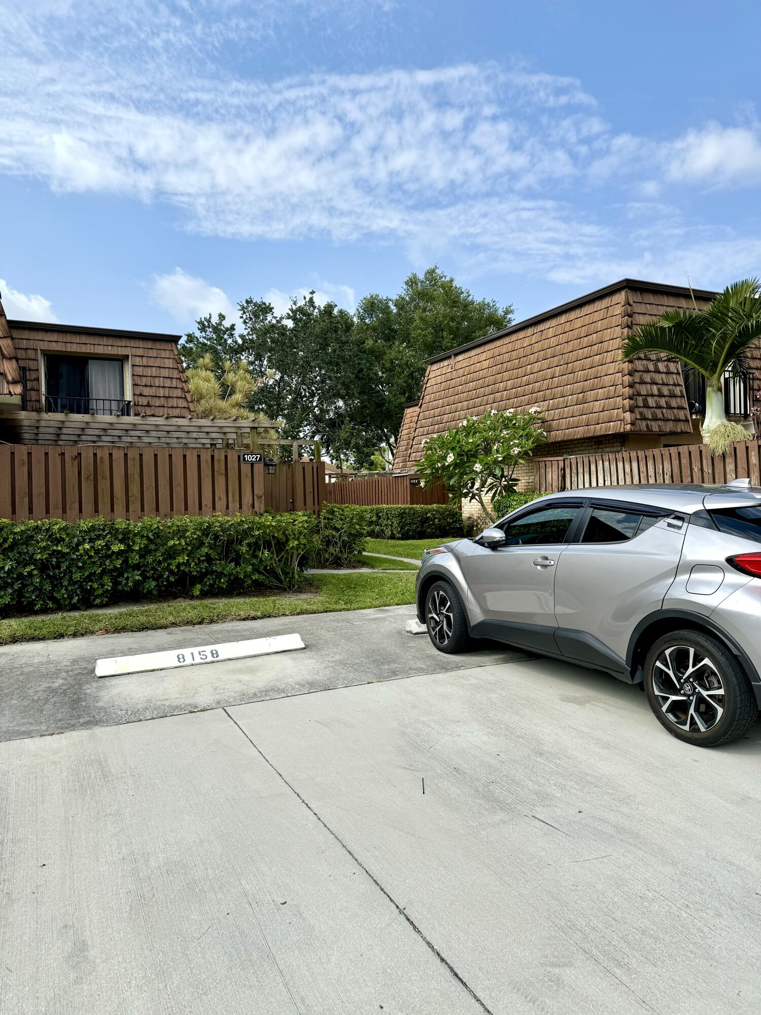 a view of a car parked in front of a house