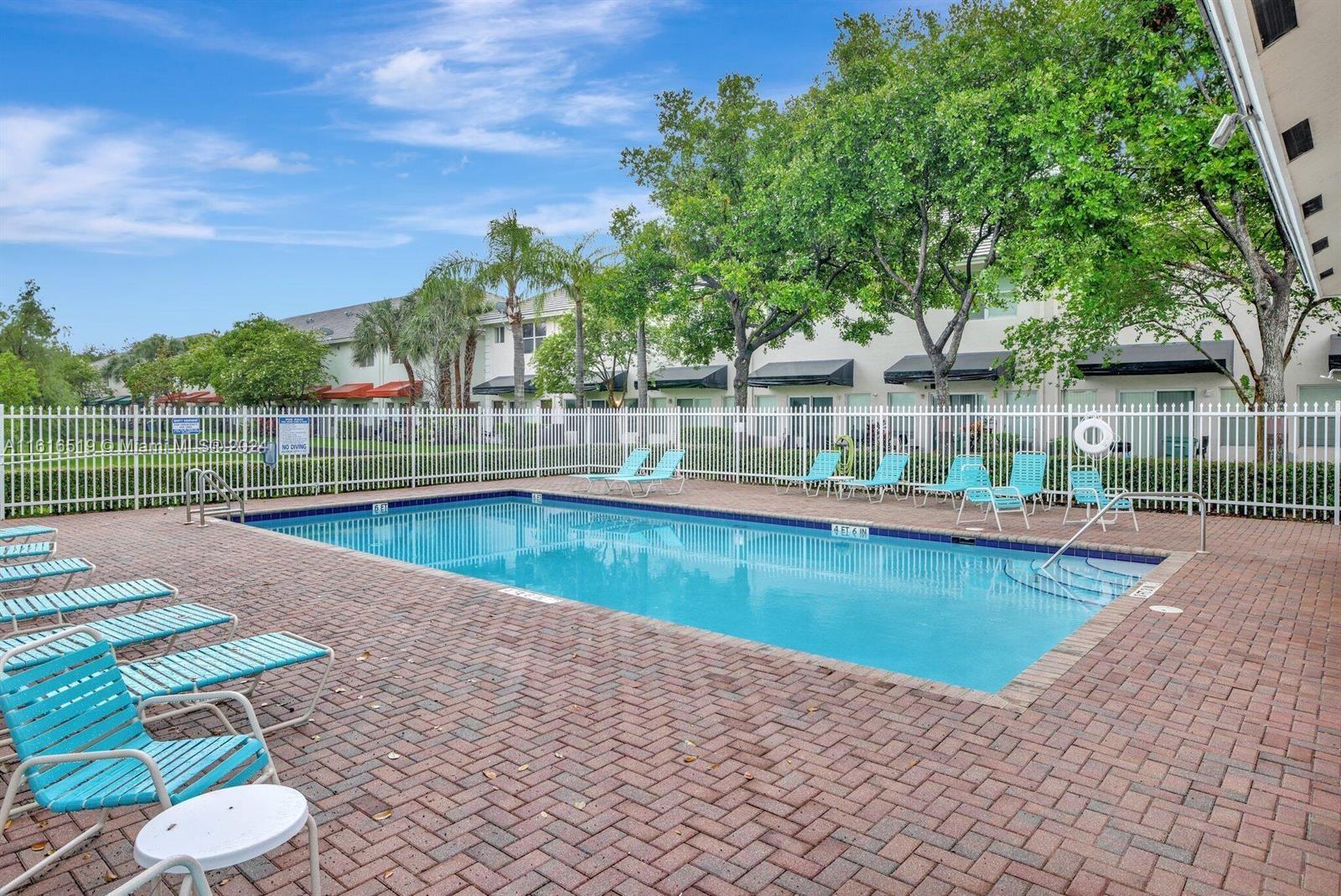 a view of a swimming pool with a patio