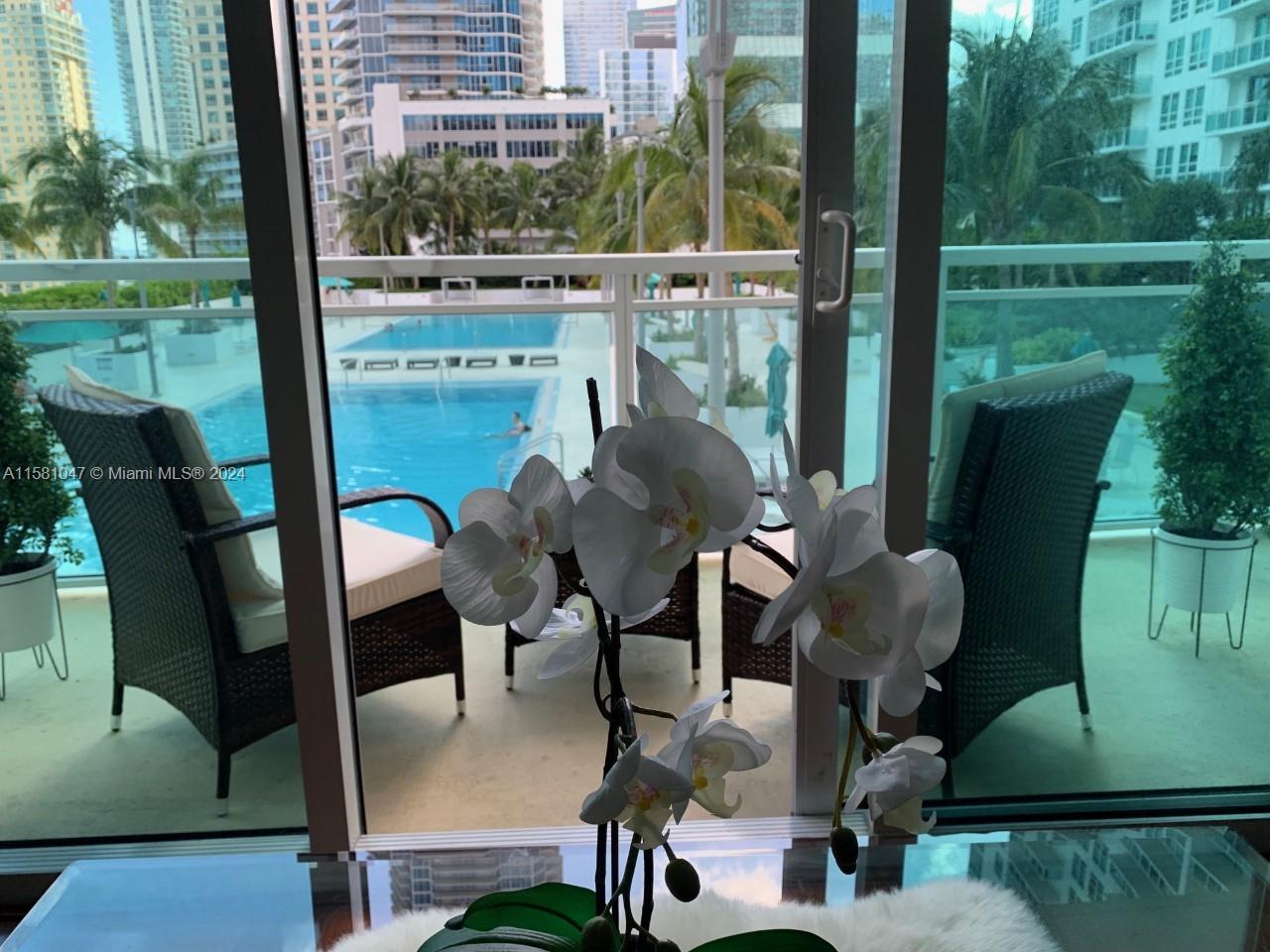 a view of balcony with outdoor seating and city view