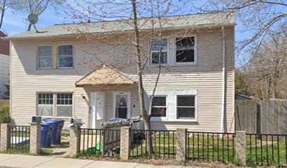 a front view of a house with glass windows