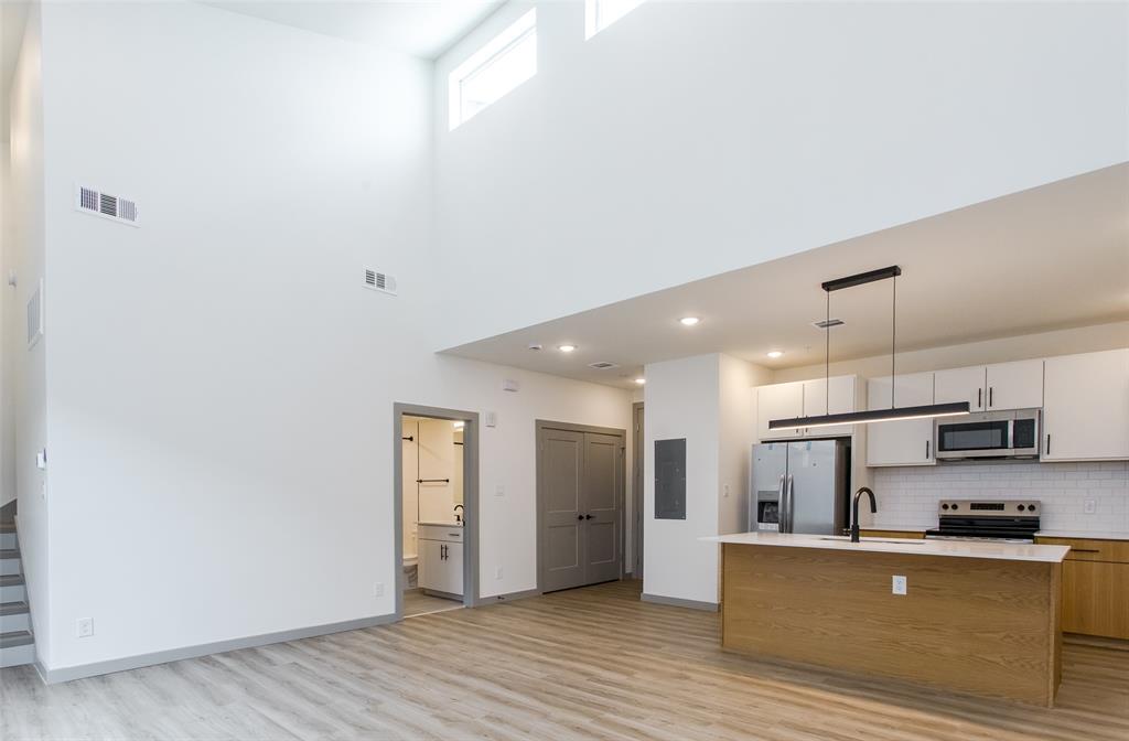 a view of kitchen with wooden floor