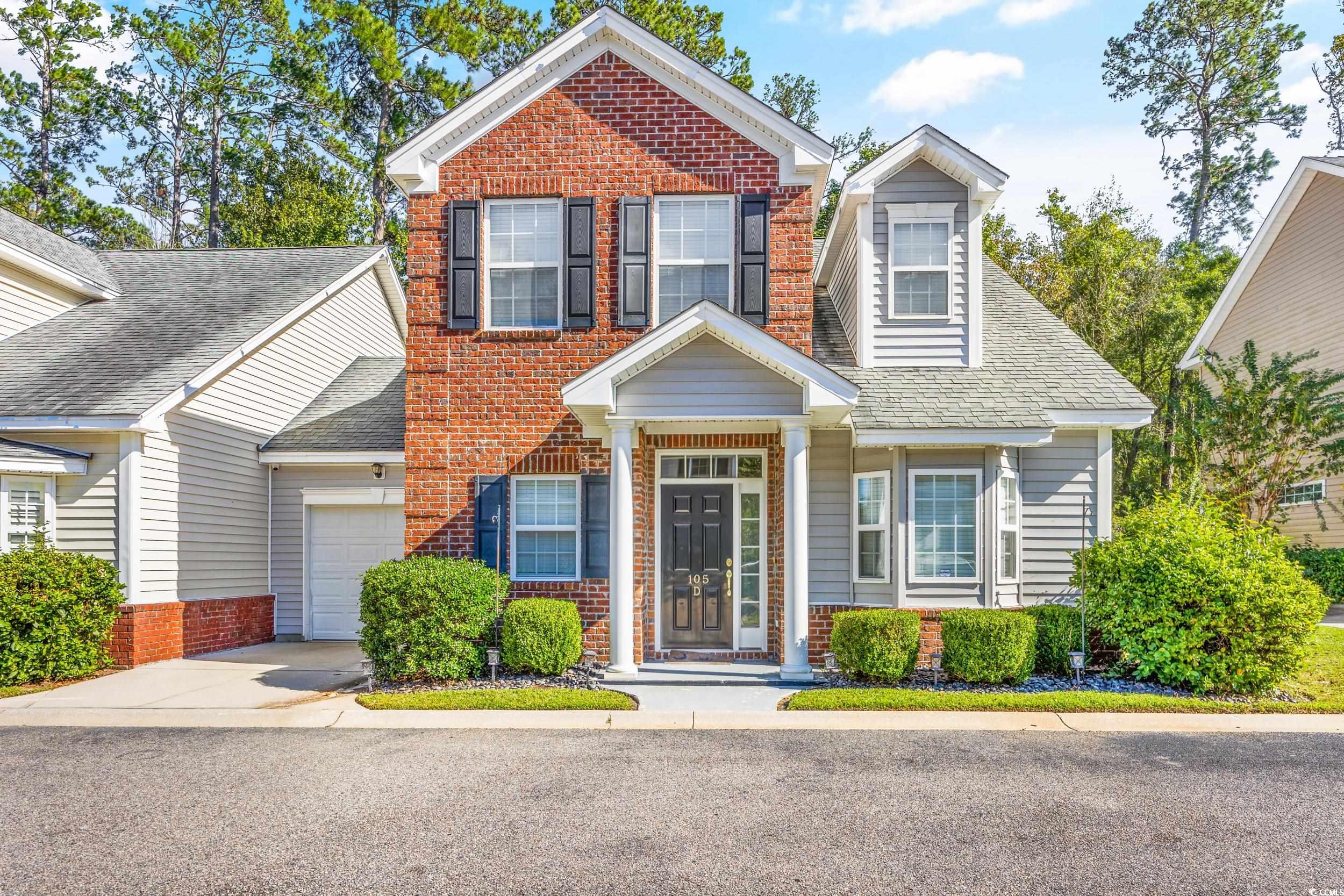 View of front of home with a garage