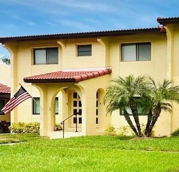 a view of a house with a yard