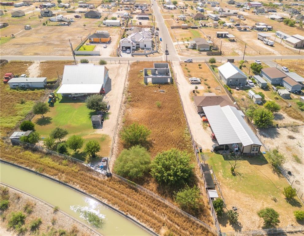 an aerial view of residential houses with yard