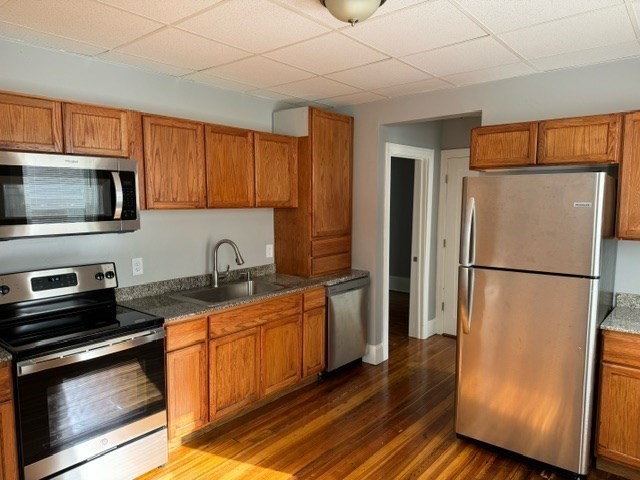 a kitchen with a refrigerator stove and microwave