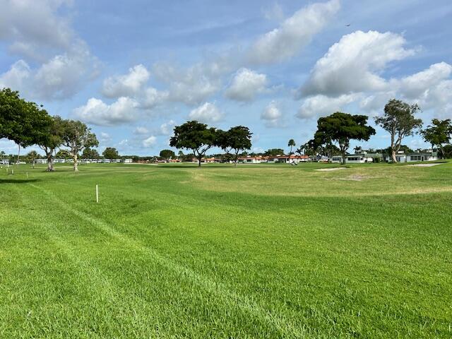 a view of a golf course with a big yard