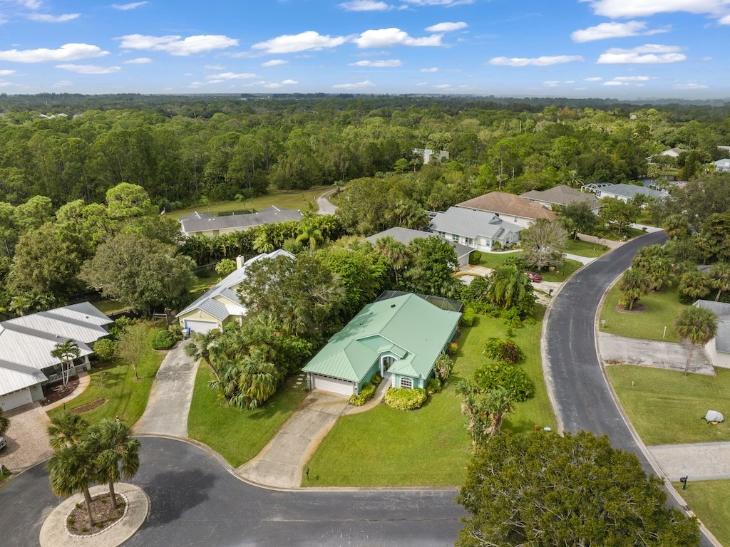 an aerial view of a house with a garden