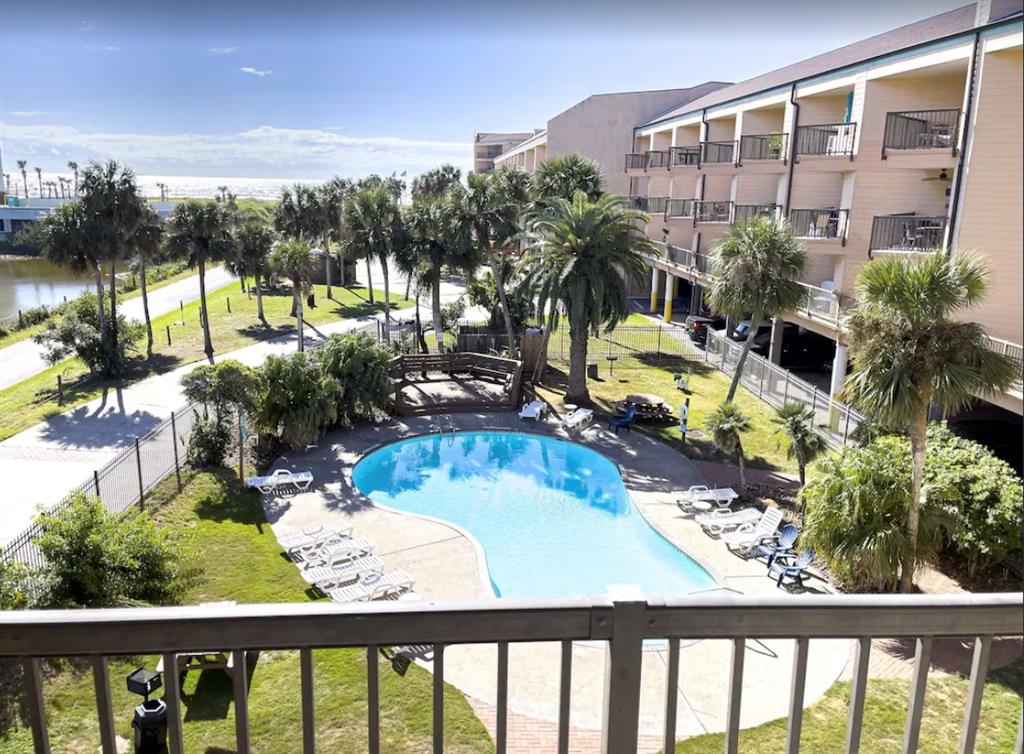 a view of swimming pool from a balcony