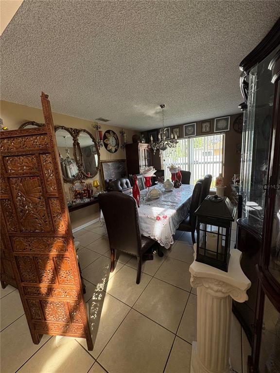 a living room with furniture a window and a flat screen tv