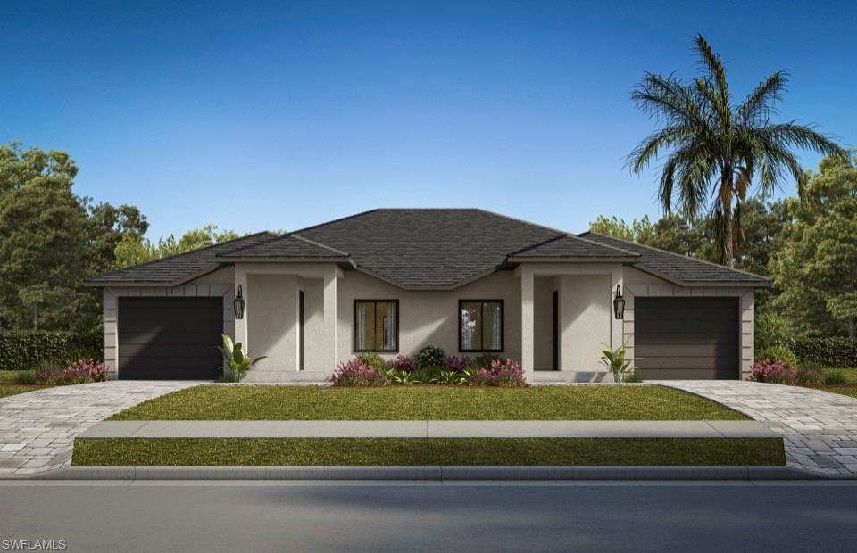 a front view of a house with a garden