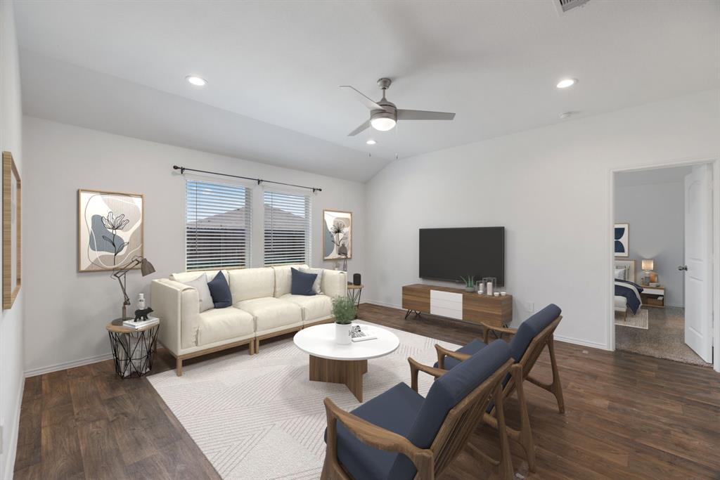 a living room with furniture and a flat screen tv