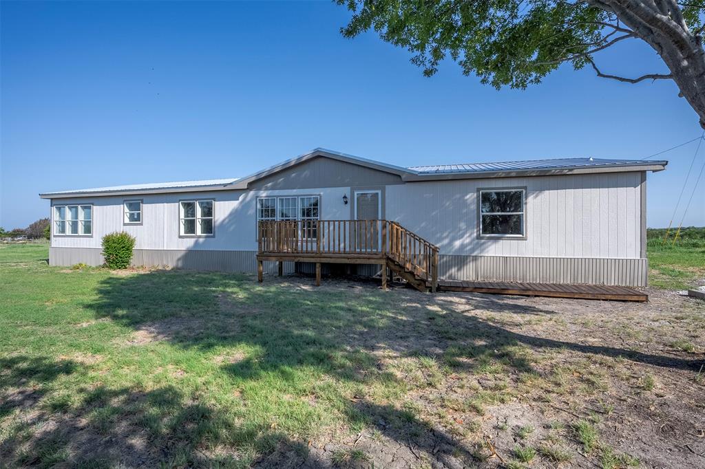 a view of house with yard and entertaining space