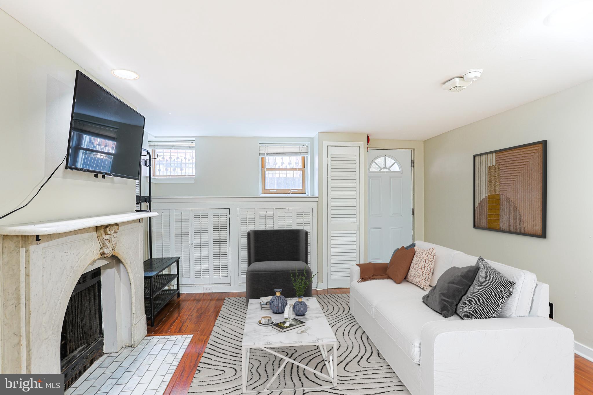 a bedroom with a bed and a fireplace