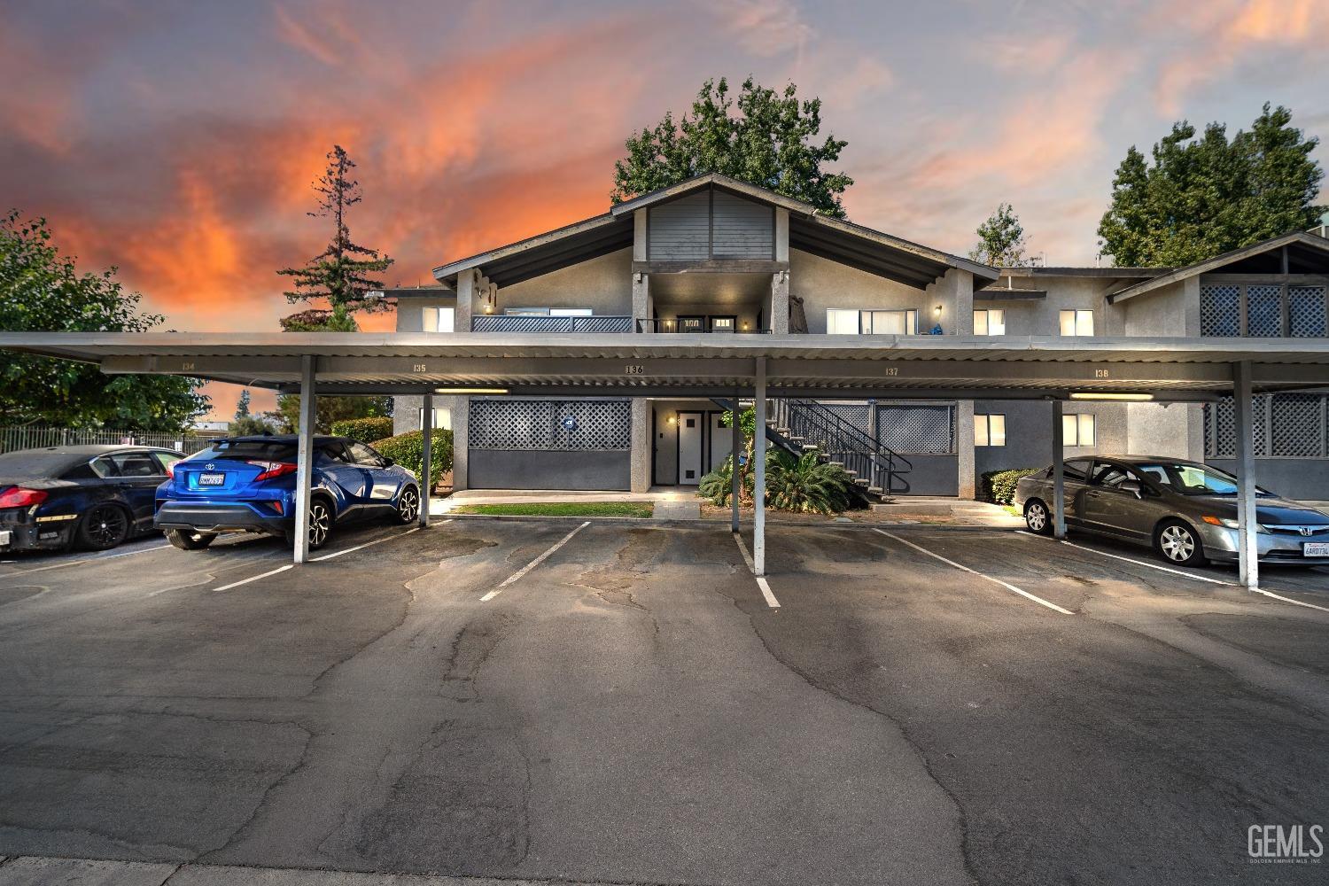 a view of a car park in front of house