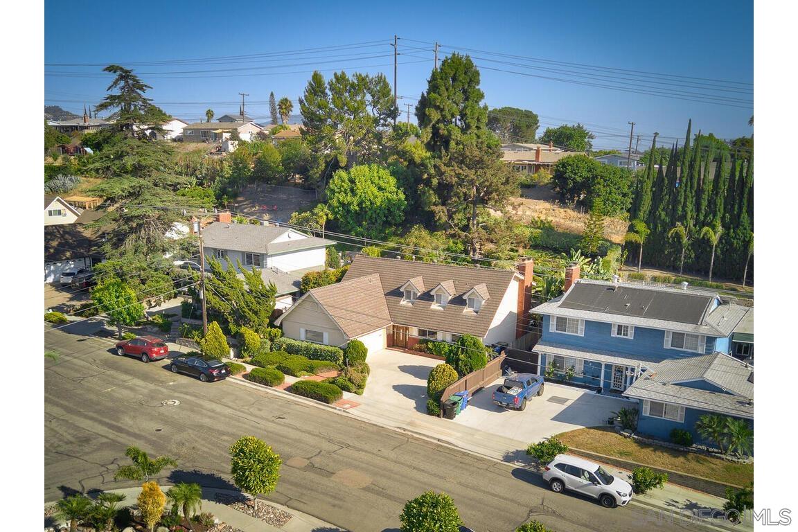 an aerial view of a house with yard swimming pool and outdoor seating