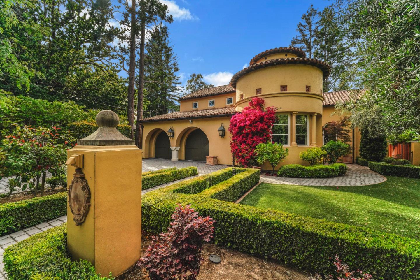 a front view of a house with garden