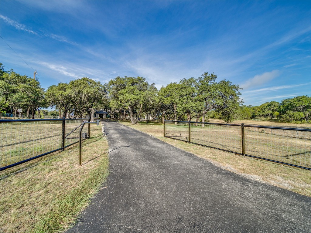 a view of pathway with yard