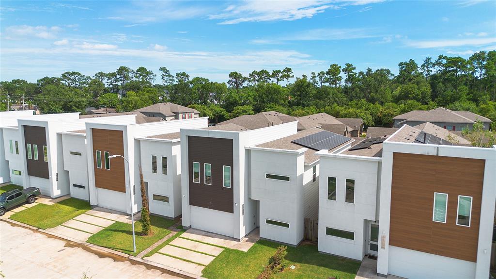 a aerial view of a house with a yard