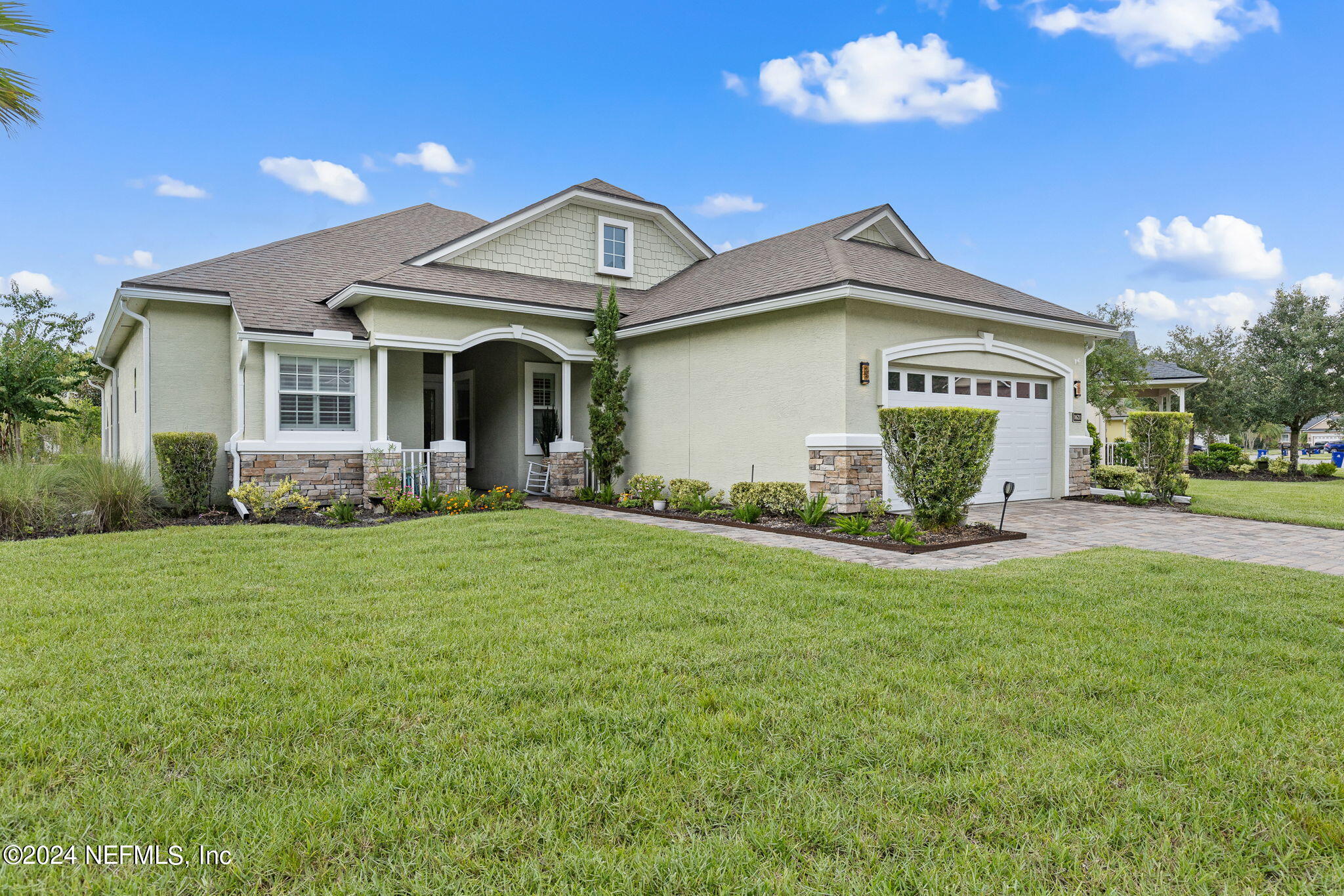 a front view of a house with garden