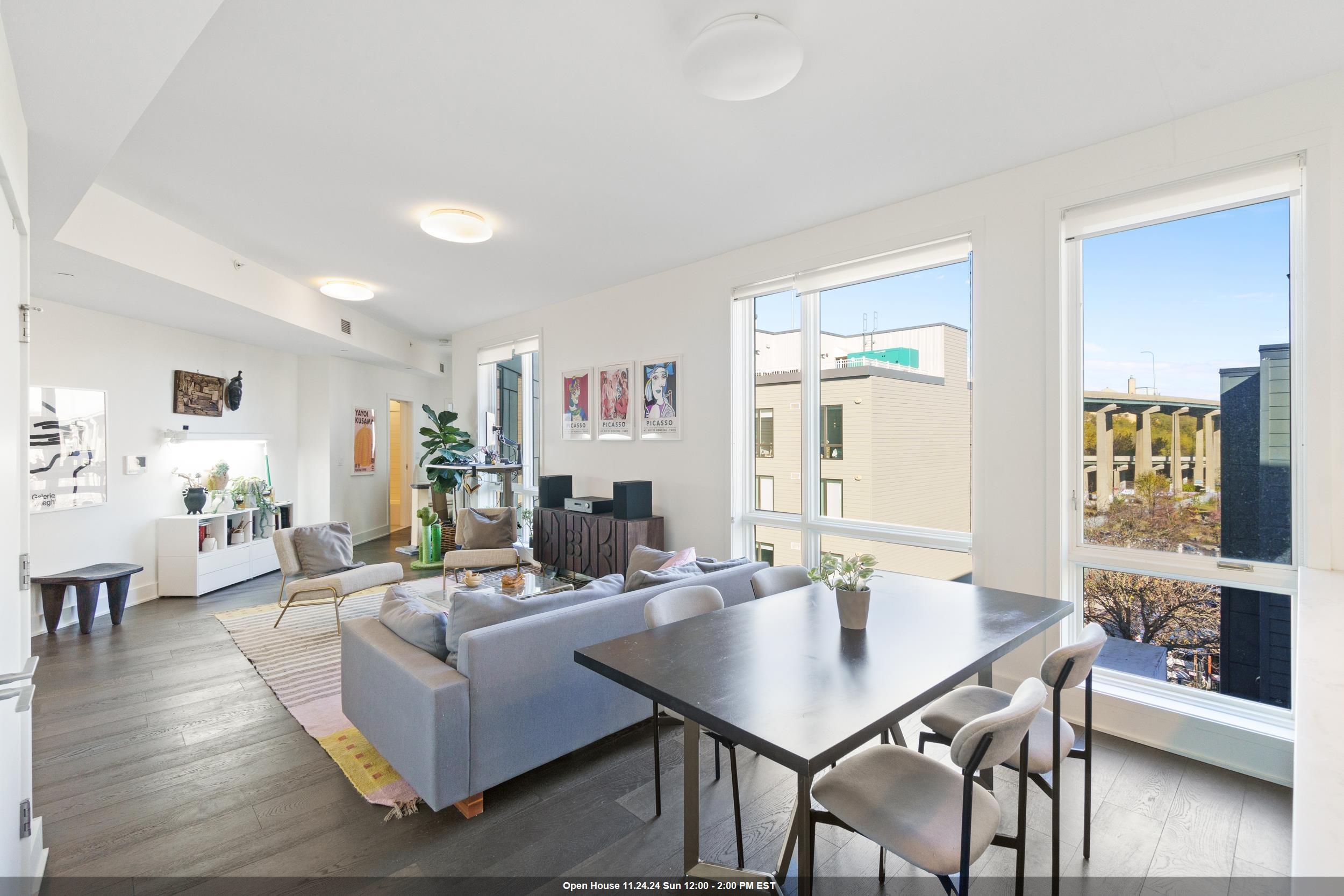 a living room with fireplace furniture and a table